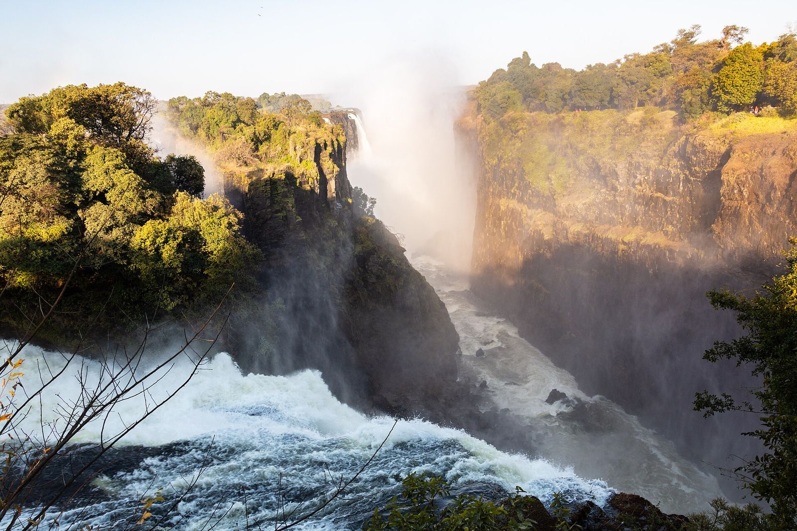 Victoria Falls plunging into its gorge in golden light